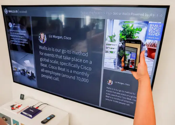 Person scanning a QR code with a smartphone
